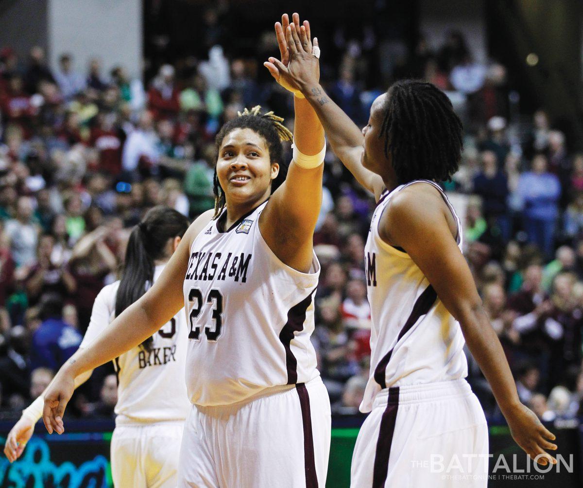 Texas A&Ms Danielle Adams (23) and teammate Tyra White celebrate after Texas A&Ms 76-70 win over Notre Dame in the womens NCAA Final Four college basketball championship game.