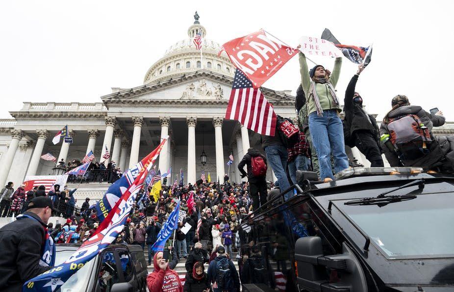 <p>Protestors rally outside of the U.S. Capitol Building following the impeachment of President Donald Trump. </p>