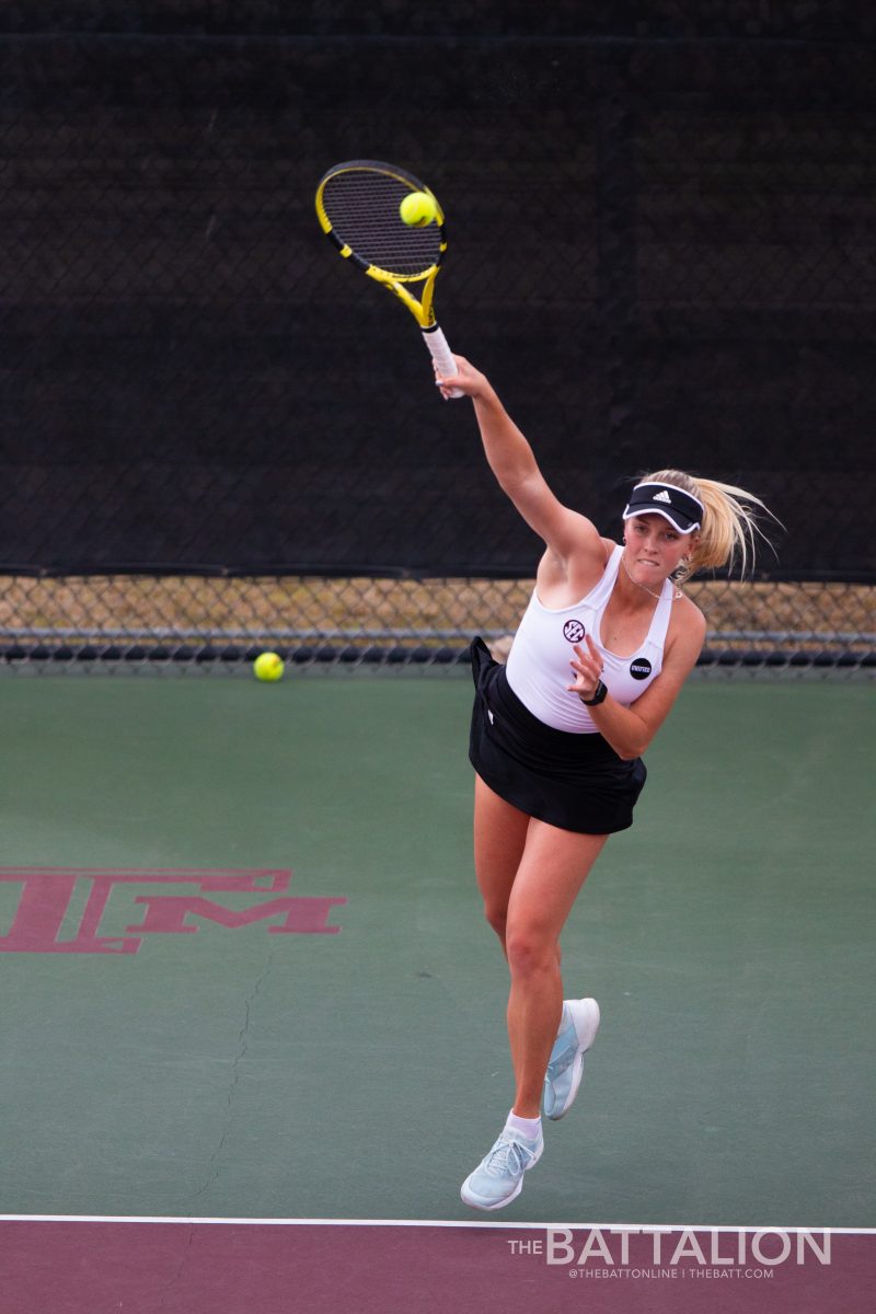 Junior Jayci Goldsmith serves the ball.