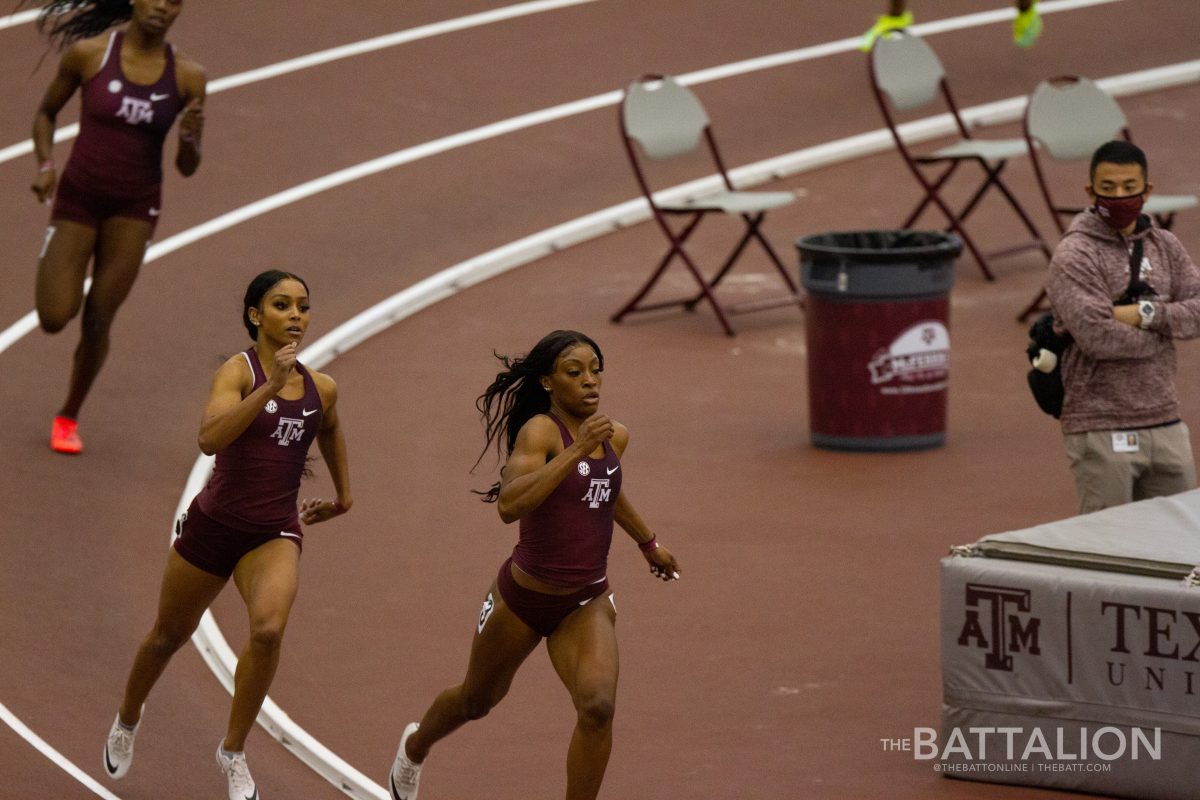 Sophomore Charokee Young and Senior Syaira Richardson hit the straightaway in the 400 meter race.