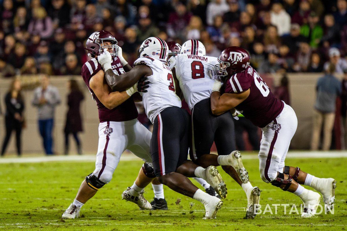 <p>Senior left tackle Dan Moore Jr. (right) announced he will forego a fifth year of eligibility and enter the 2021 NFL draft.</p>