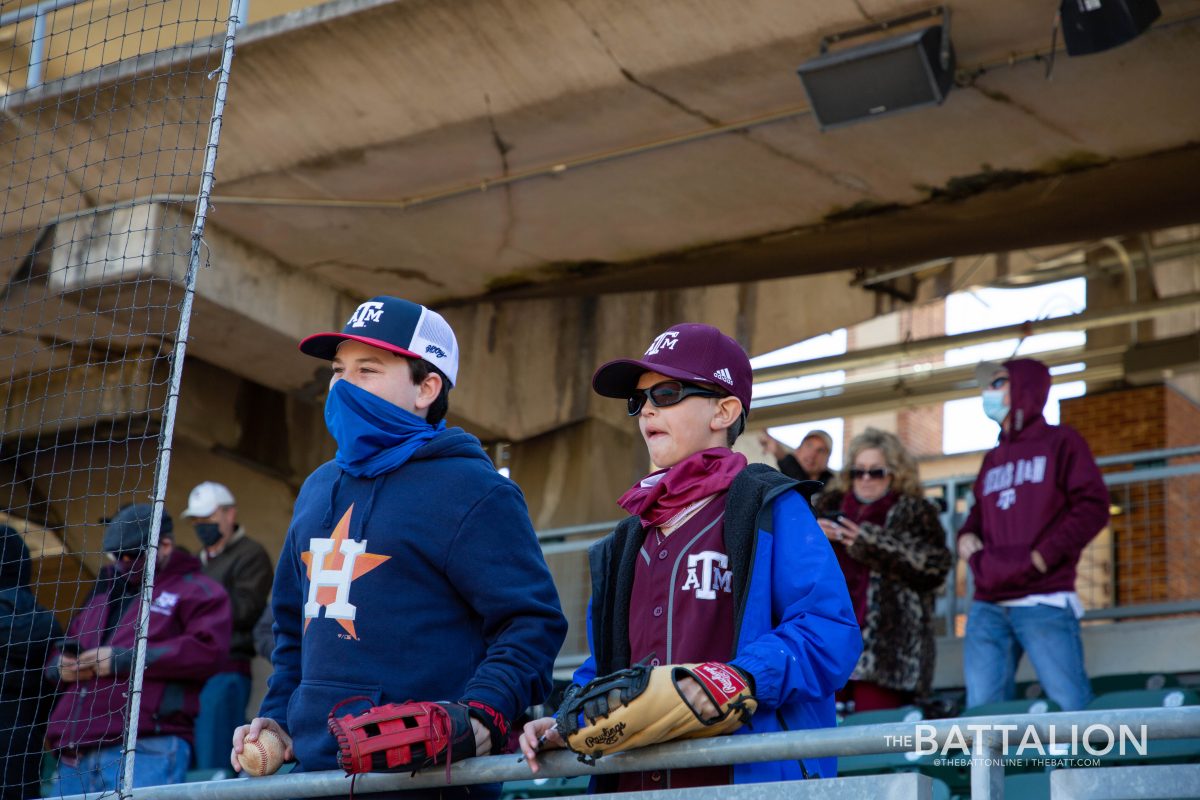Two kids grabbed the attention of junior infielder Ty Coleman to sign their baseballs.