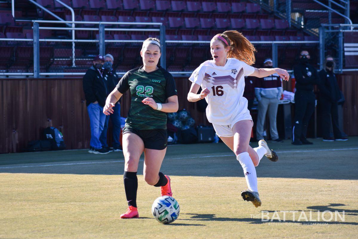 Junior defender Macie Kolb tries to win the ball back from UNTs senior forward Berklee Peters during a Feb. 20 exhibition game.