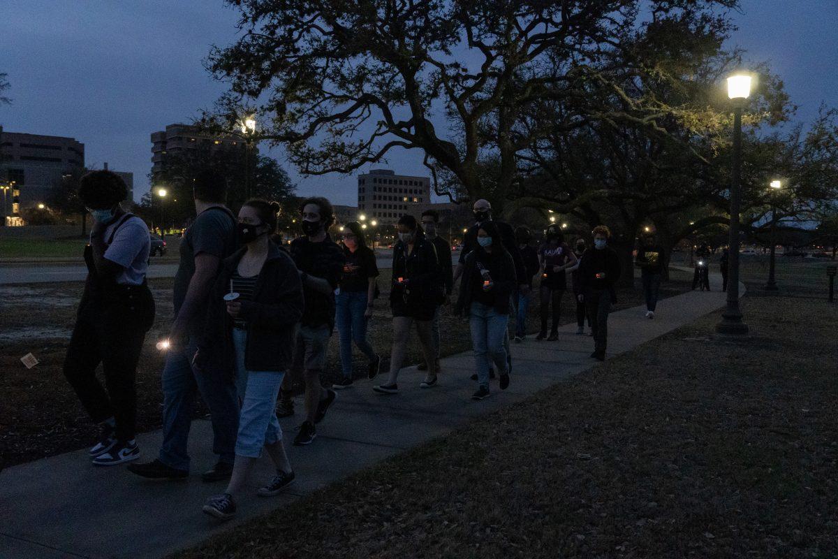 Attendees+of+the+COVID-19+vigil+silently+walked+around+campus+in+honor+of+the+lives+lost+during+the+pandemic%2C+taking+a+route+similar+to+Elephant+Walk.