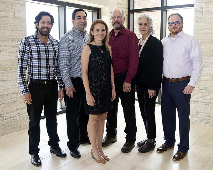 The College of Veterinary Medicine & Biological Sciences program director Vince Hardy (third from right), has faced backlash throughout the week for comments made in his reply-all email regarding the LGBTQ+ community. 
