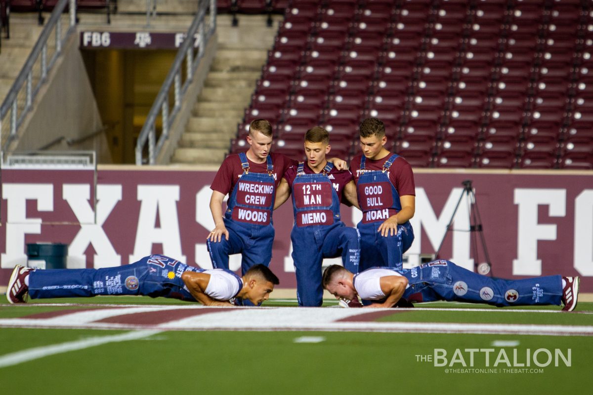 The senior Yell Leaders supervise and offer words of encouragement to the junior Yell Leaders before the start of Yell Practice.