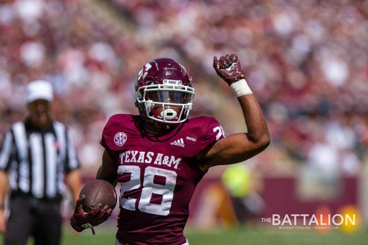 Isaiah Spiller runs towards the endzone for a touchdown.