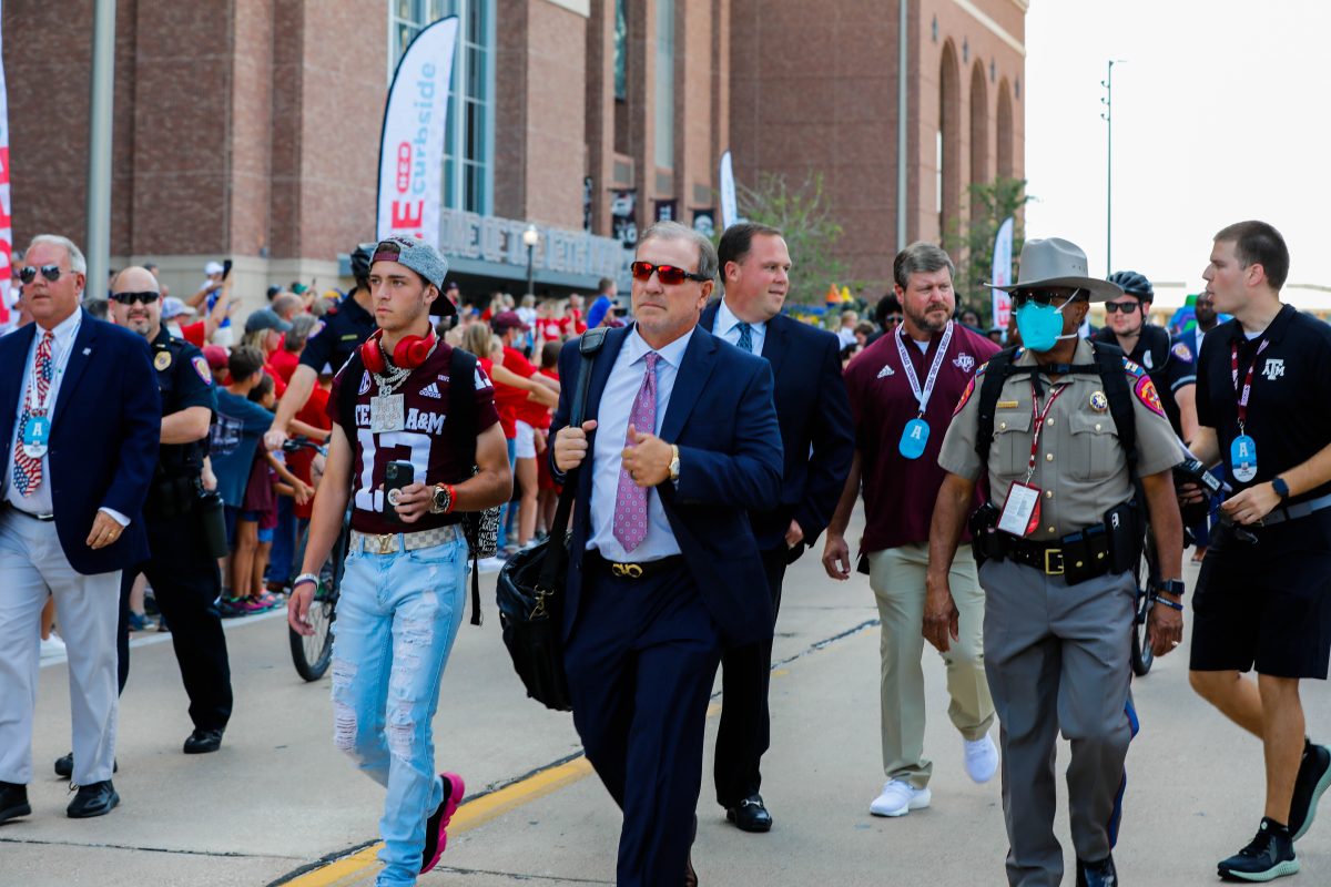 Head football coach Jimbo Fisher makes his way into Kyle Field for the first game of the season. 