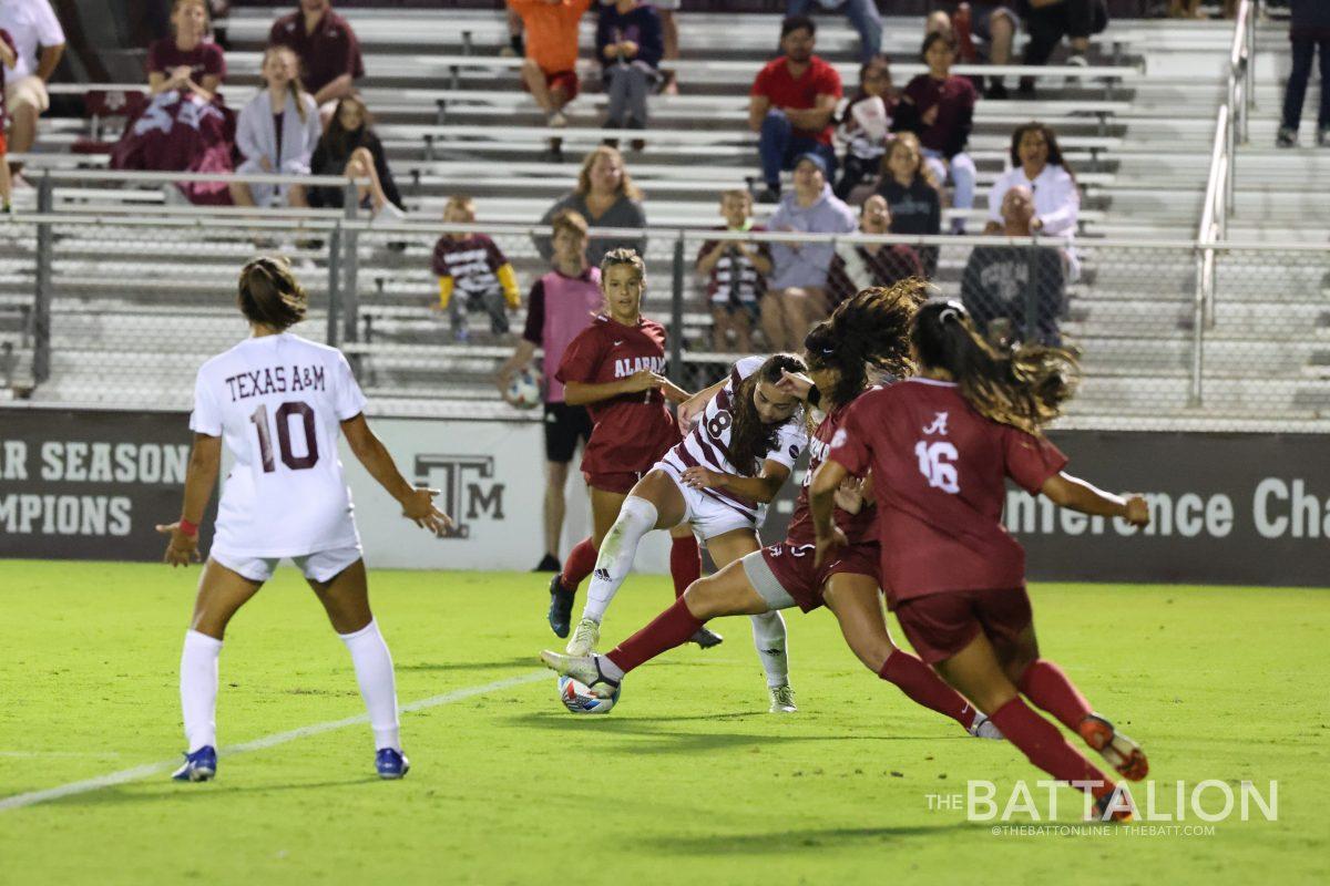 Freshman forward Maile Hayes dribbles past the Alabama defense.