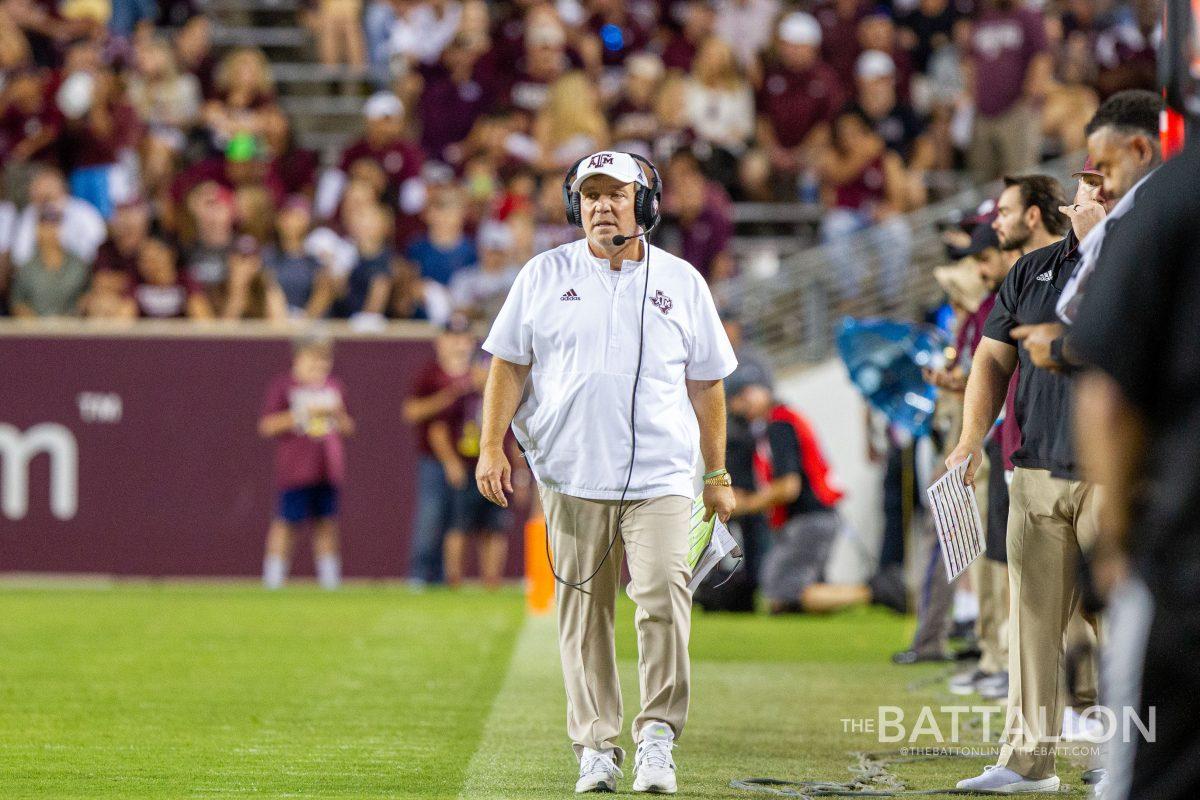 Texas A&M head coach Jimbo Fisher walking down the sideline.