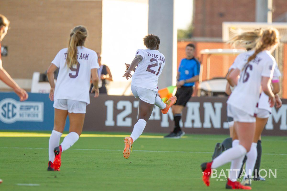 Senior defender Karina Sample kicks the ball down the field.