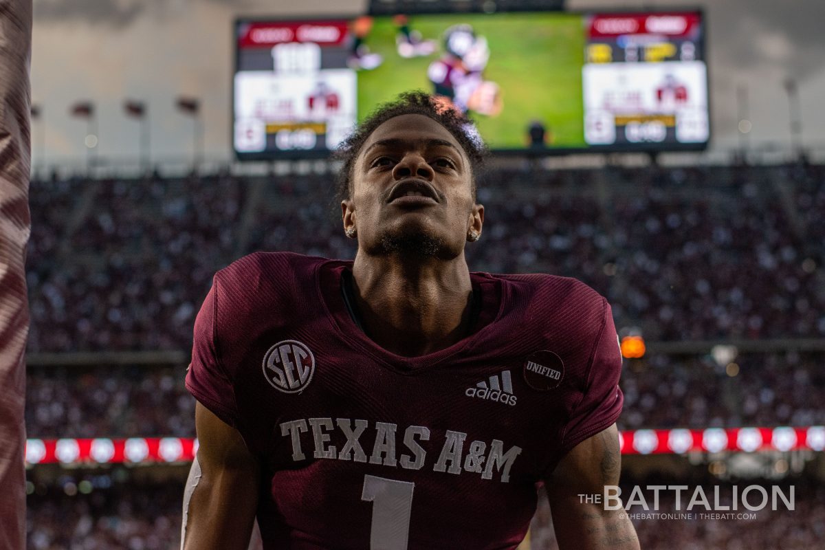 Wide receiver Demond Demas kneeling in the end zone before kickoff.