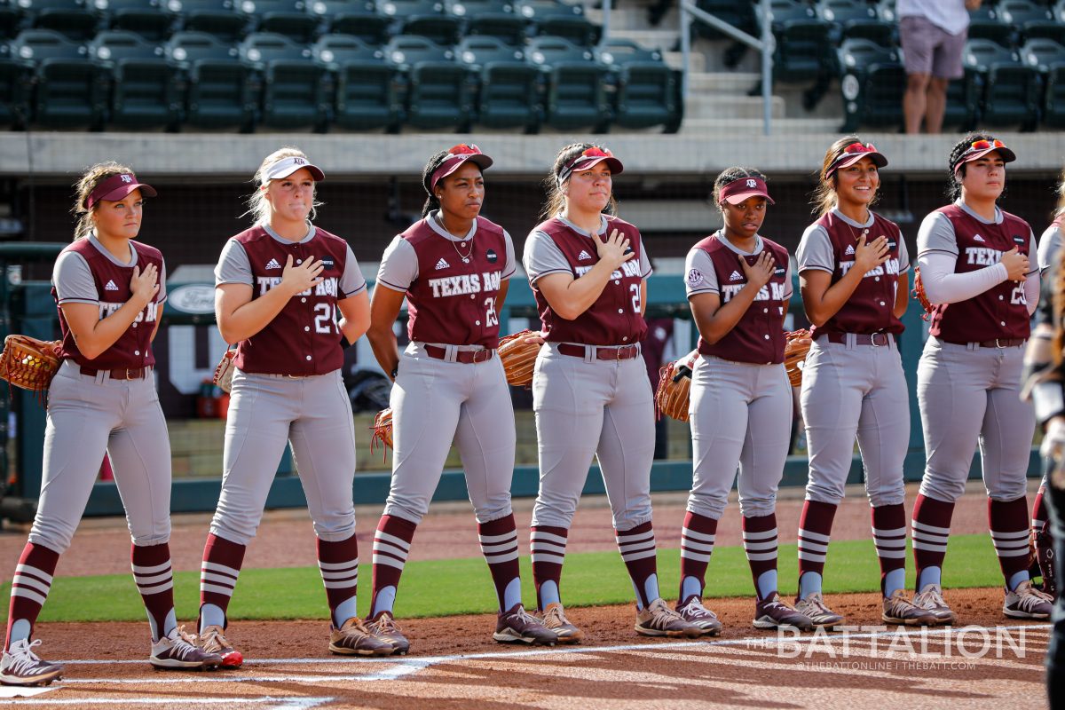 The Texas A&M softball team lined the field for the National Anthem before the Wednesday, Oct. 20 doubleheader against Temple College. 