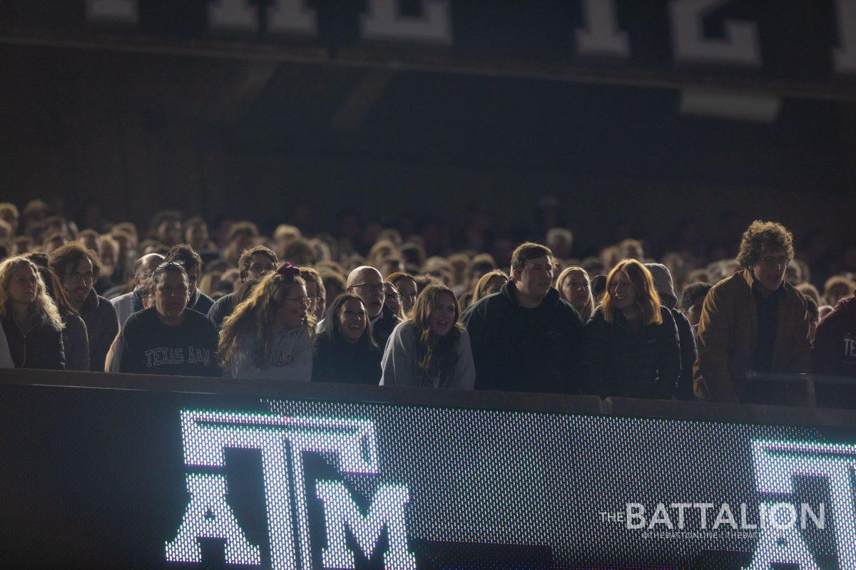 The 12th Man on the second deck of Kyle Field singing the Spirit of Aggieland.