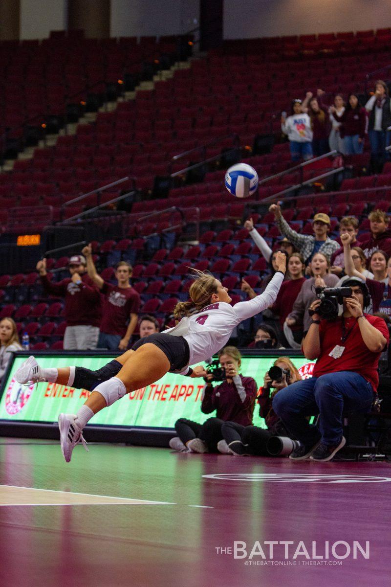 Freshman&#160;Brooke Fraizer&#160;dives to save the ball from going out of bounds.