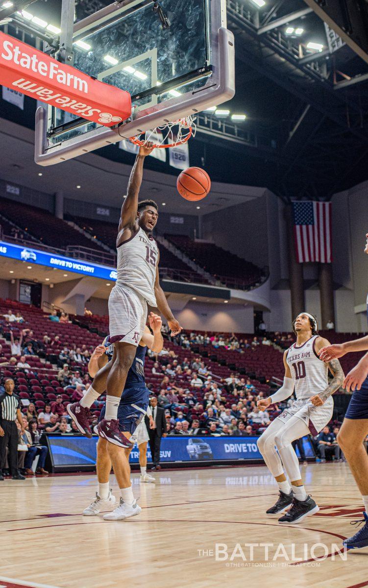 Seconds left in the game, freshman Henry Coleman III dunks the ball for the last points of the game.