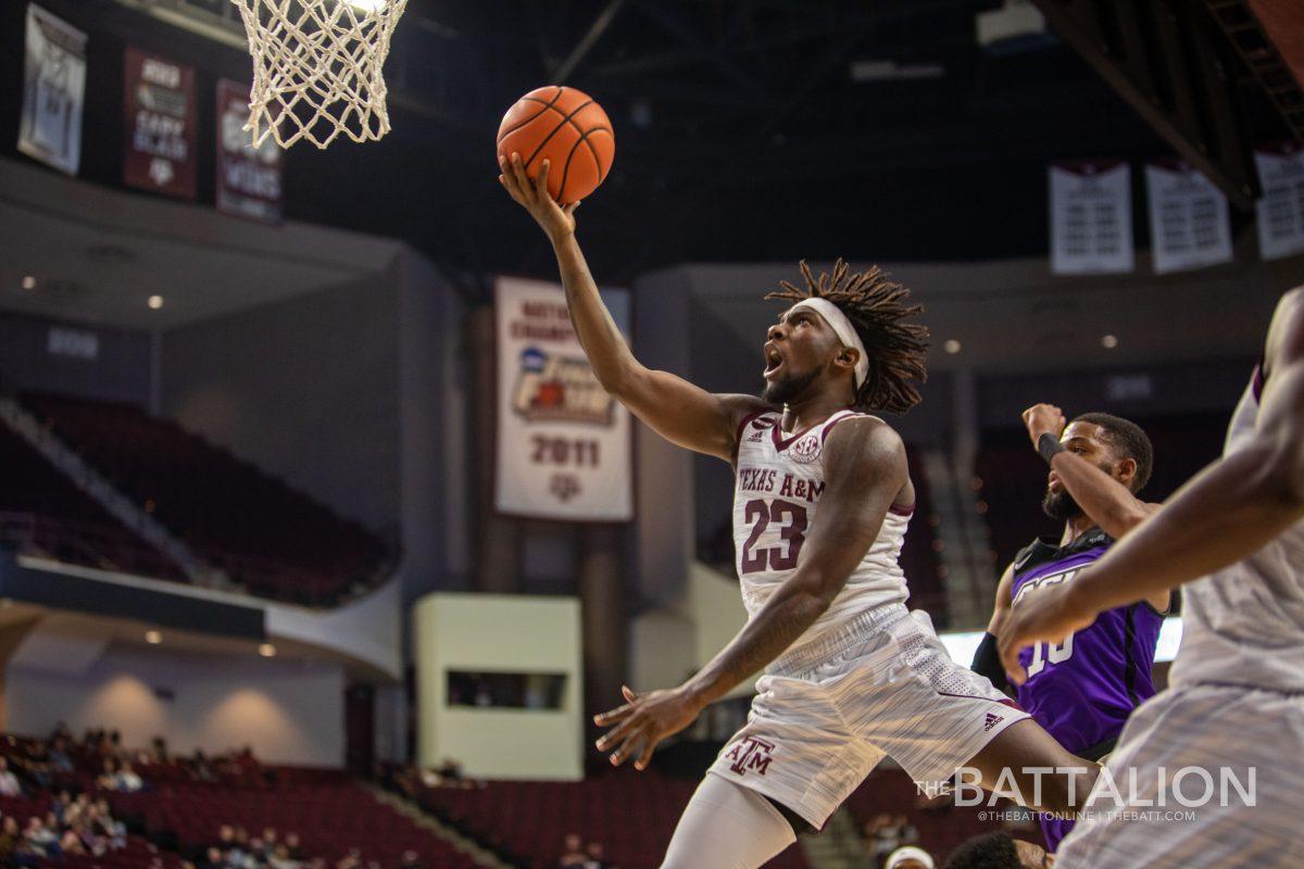 Junior guard Tyrece Radford dunking during the Aggies' double-overtime win over Abilene Christian.&#160;