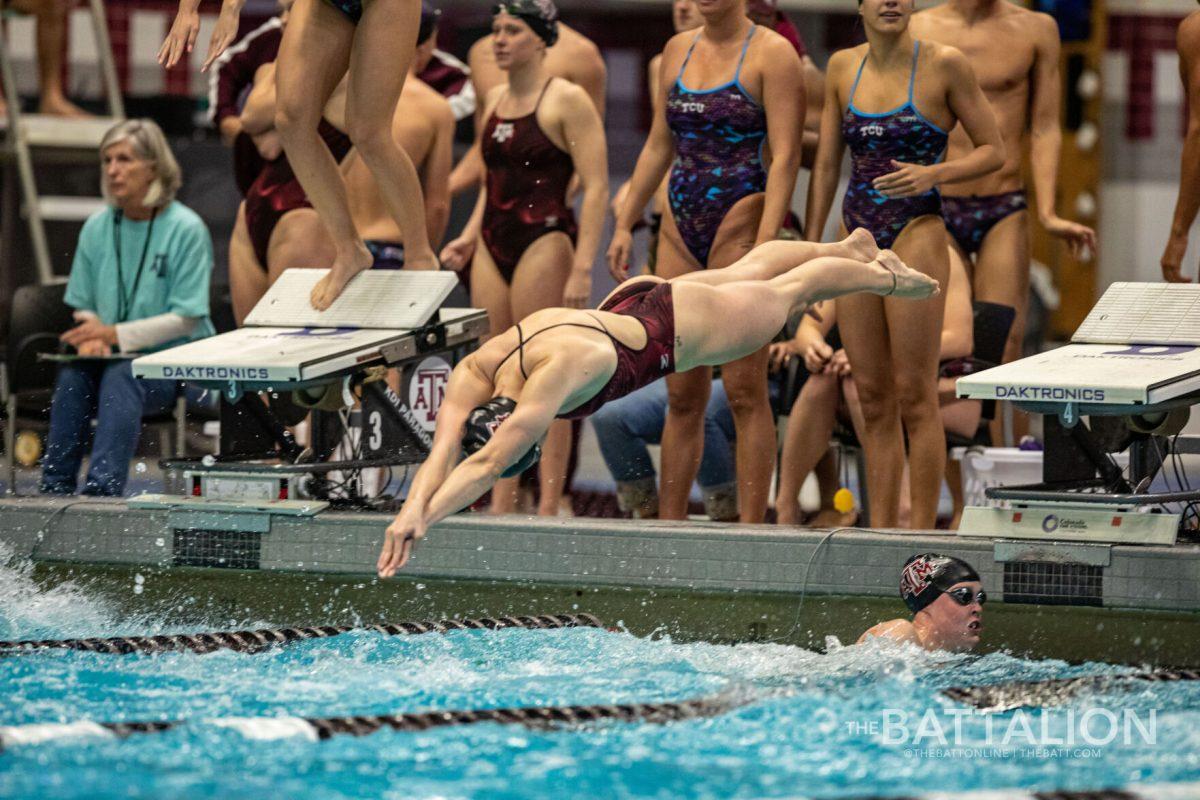 Freshman Kaitlyn Owens midair as she acts as the anchor for the Women's 200 Yard Freestyle Relay.