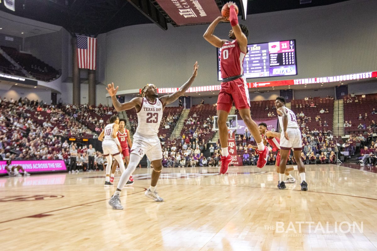 Guard+Stanley+Umude+%280%29+jumps+to+shoot+on+junior+guard+Tyrece+Radford+%2823%29+in+the+Aggies+game+against+the+Razorbacks+on+Saturday%2C+Jan.+8%2C+2022.