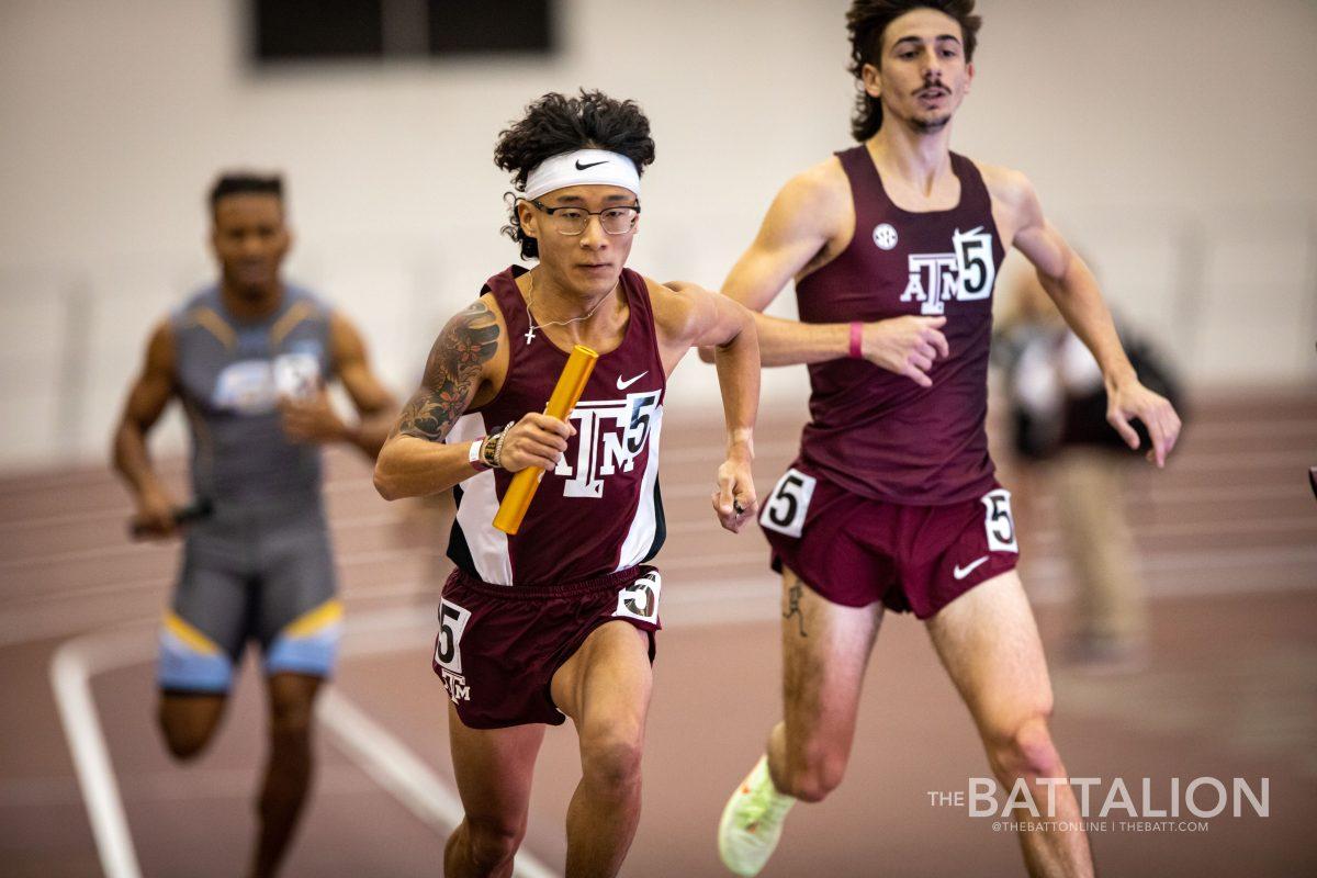 Sophomore Jonathan Chung received senior Gavin Hoffpauirs baton exchange for the final leg of their meet-record time in the distance medley race.