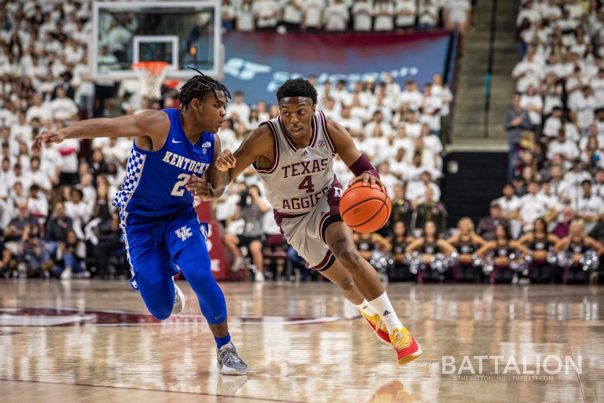 Freshman guard Wade Taylor IV (4) dribbles down the court in Reed Arena on Wednesday Jan. 19, 2022.