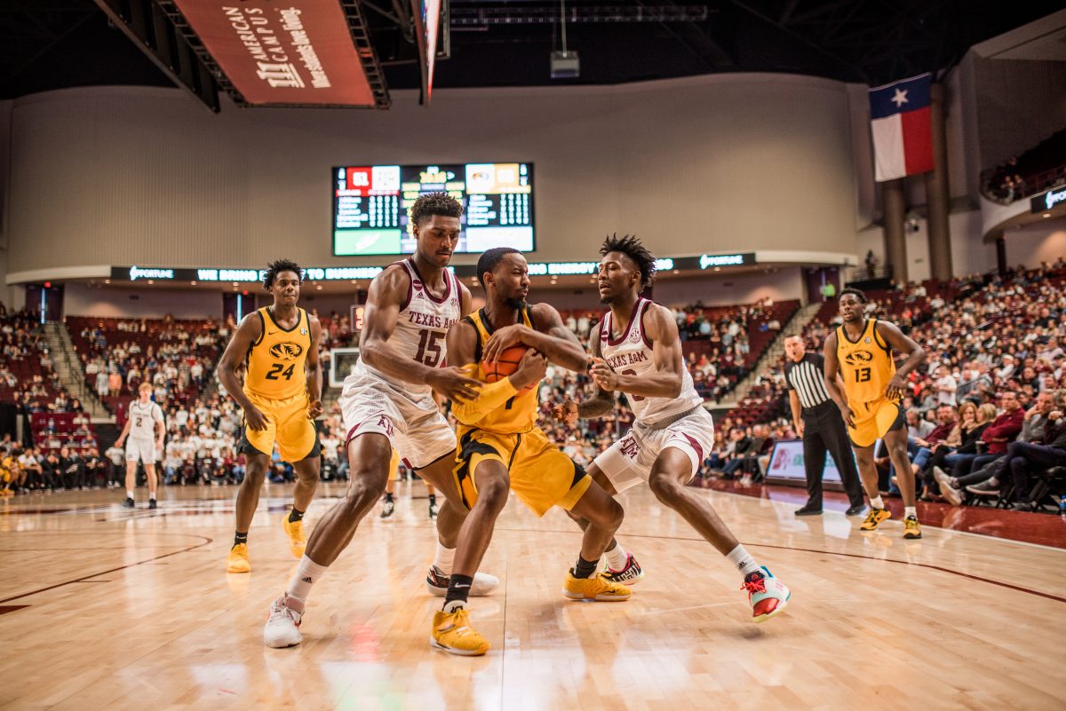 Freshman&#160;Henry Coleman&#160;and graduate&#160;Quenton Jackson&#160;block the Missouri player.&#160;