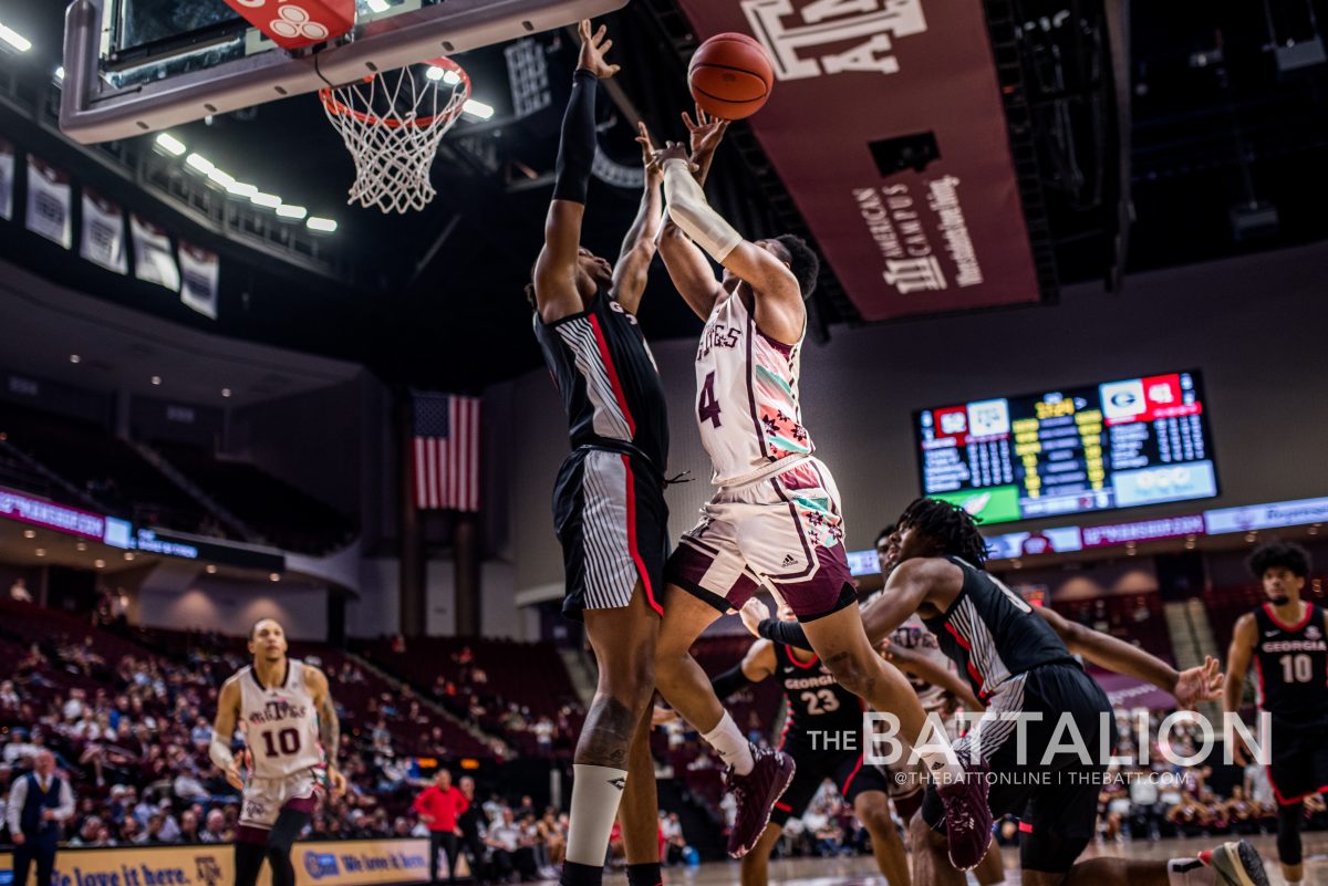 The Georgia defense tries to catch the rebound off freshman Wade Taylors (4) rebound in Reed Arena on Tuesday, Feb. 22, 2022.