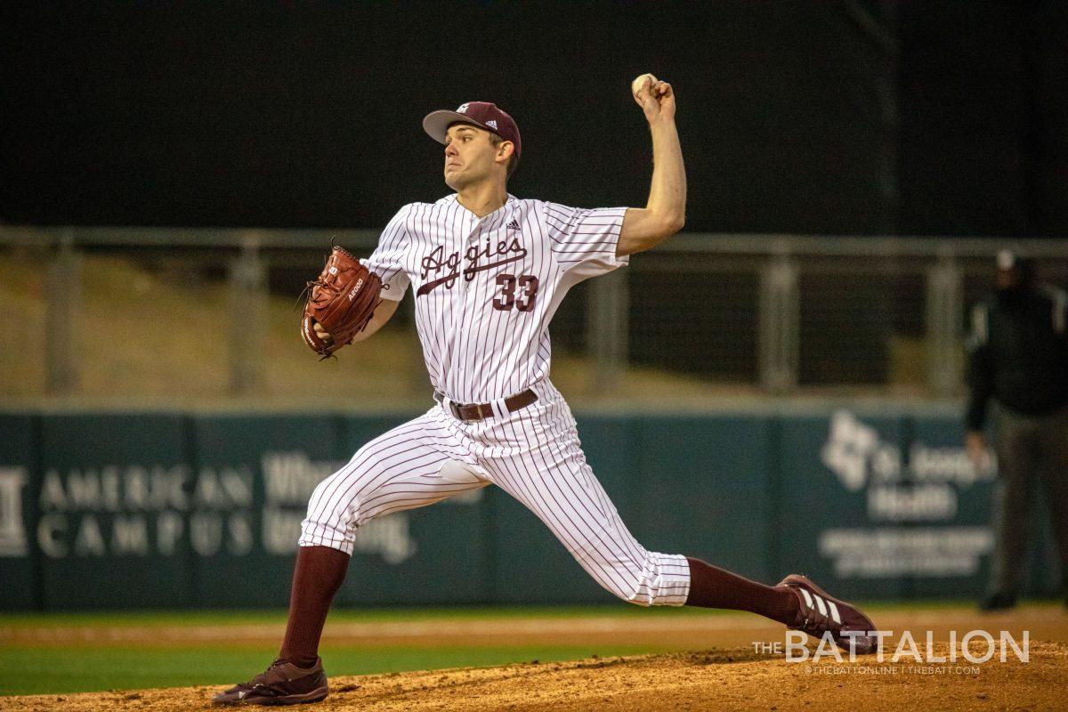 Senior pitcher Jacob Palisch (33) throws a pitch during the seventh inning of opening day at Blue Bell Park on Friday, Feb. 18, 2022.