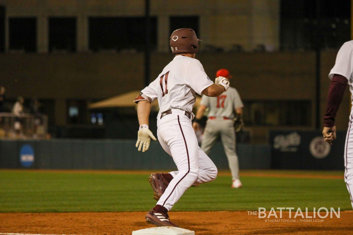 Junior designated hitter Austin Bost (11) runs for a double in Blue Bell Park on Tuesday, Feb. 22, 2022.
