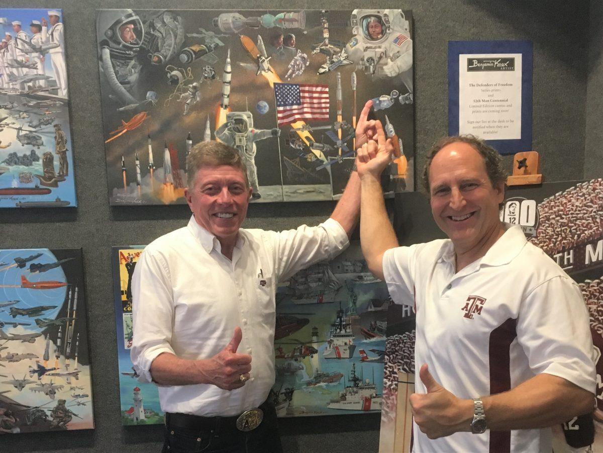 Former astronaut and the Chief Operating Officer at Texas A&M Galveston, Col. Mike Fossum 80, USAFR (Ret.), and artist, Benjamin Knox, besides Knoxs painting, Space Force - Semper Supra! which Fossum is featured in.