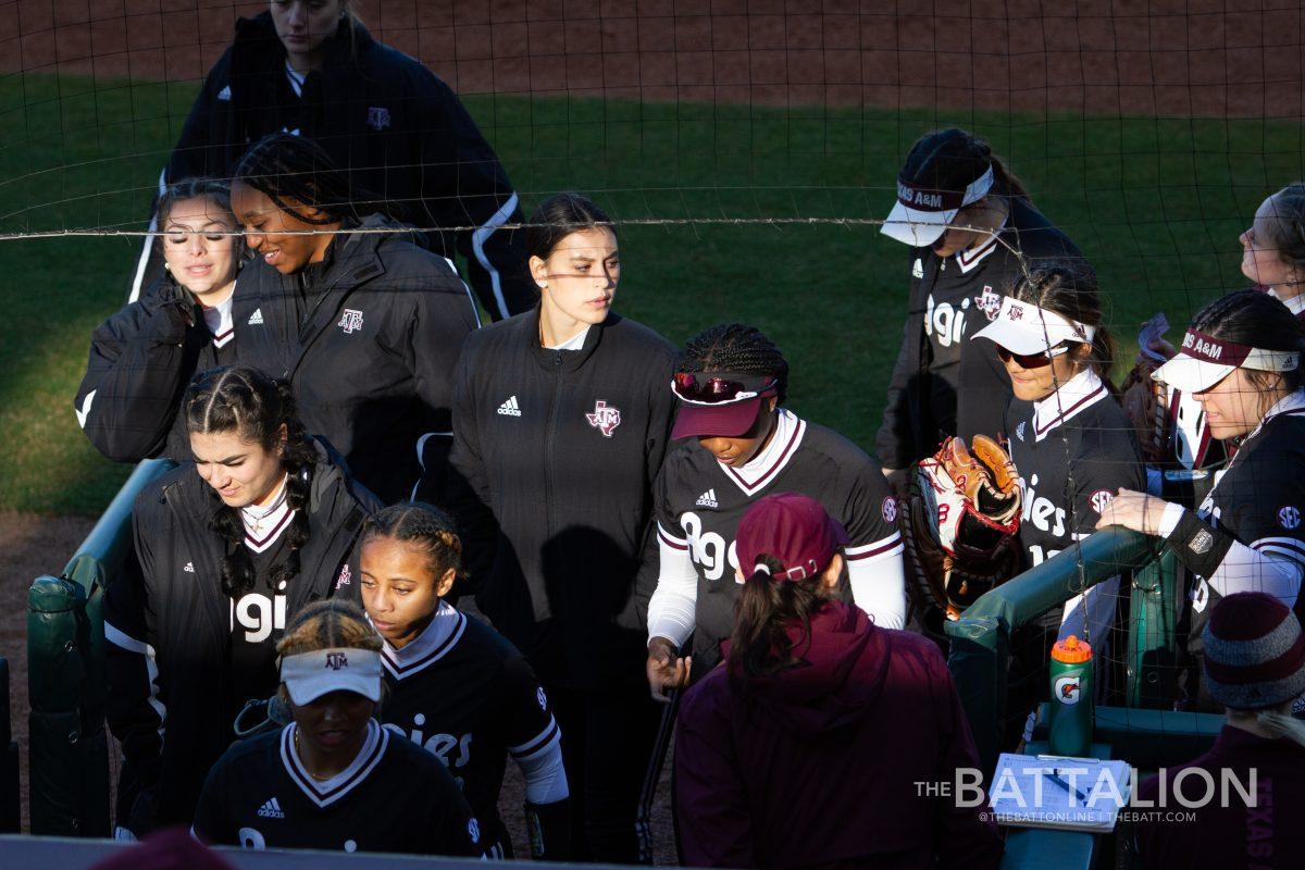 Sophomore pitcher and outfielder Grace Uribe (8) looks around as the Aggies return to the dugout in Davis Diamond on Friday, Feb. 18, 2022.