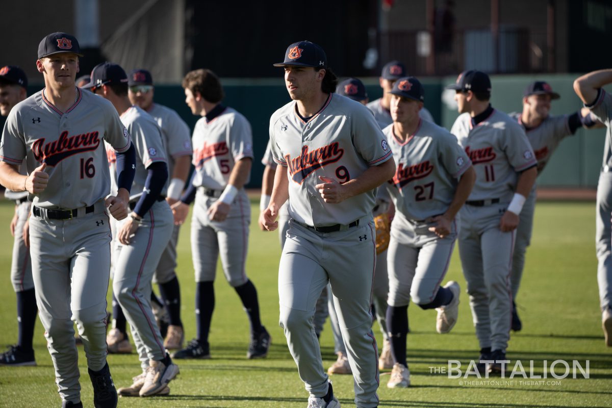 Auburn heads to the dugout at Olsen Field in Blue Bell Park on Friday, March 25, 2022.