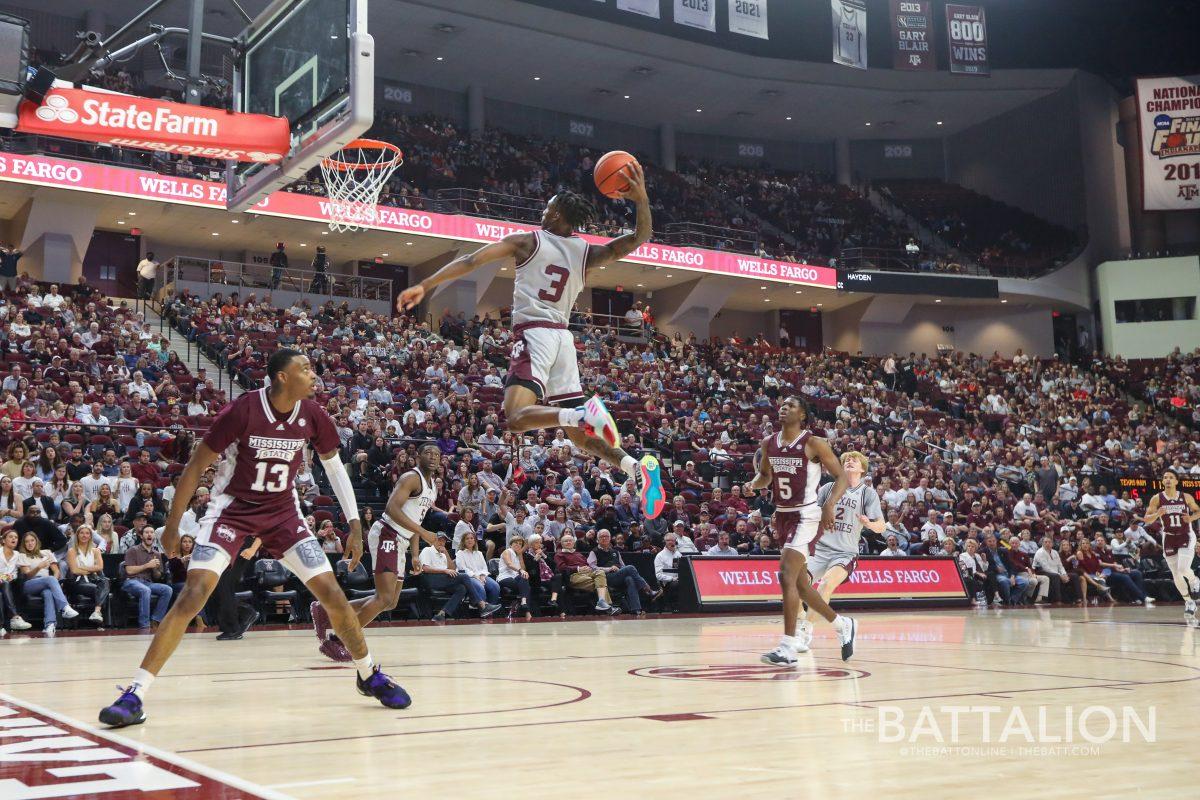 <p>Fifth-year guard Quenton Jackson (3) jumps to dunk on the Mississippi State basket in Reed Arena on Saturday, Mar. 5, 2022.</p>