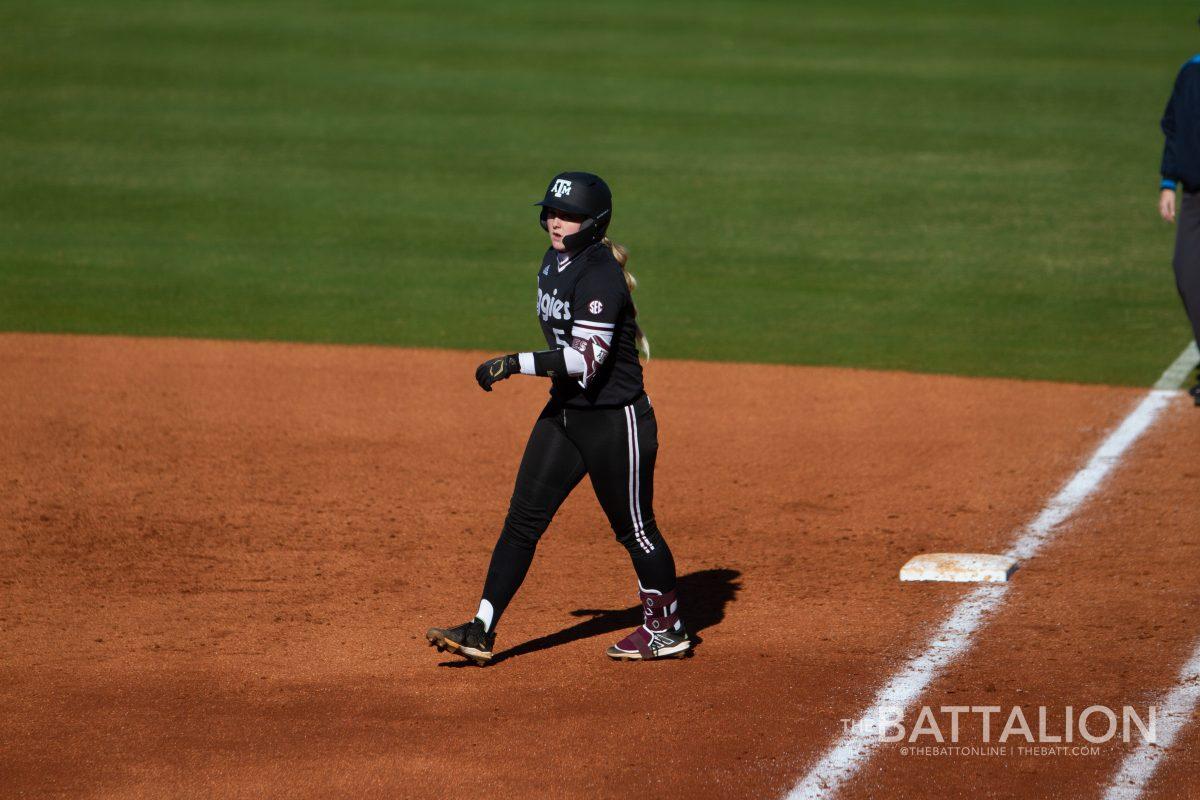 Sophomore catcher and outfielder Mayce Allen (5) walking off first base in Davis Diamond against Kansas on Friday, Feb. 18, 2022.