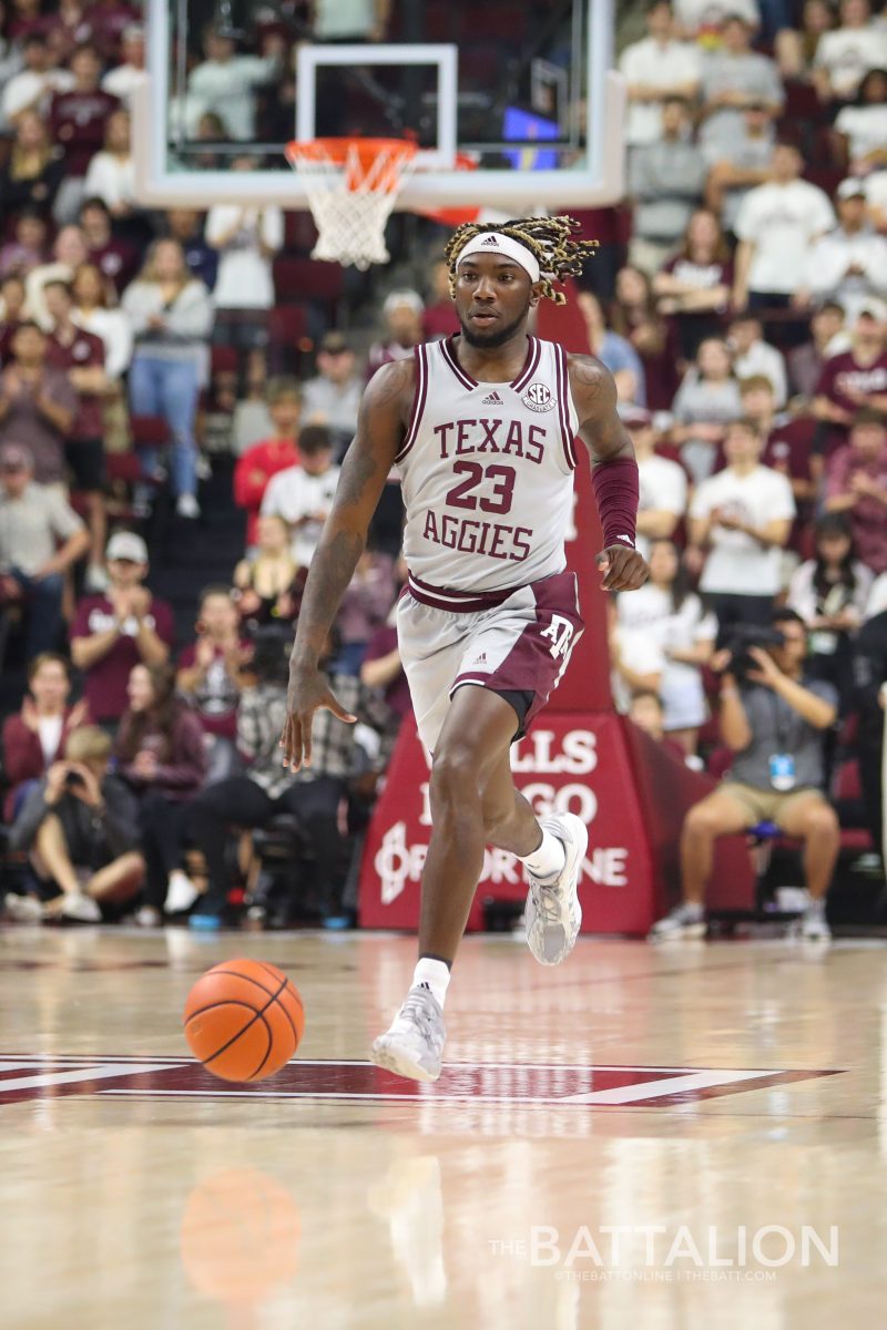 <p>Junior guard Tyrece Radford (23) runs down the court in Reed Arena on Saturday, Mar. 5, 2022.</p>