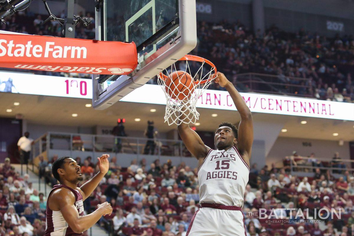 <p>Sophomore forward Henry Coleman III (15) dunks on the Mississippi State basket in Reed Arena on Saturday, Mar. 5, 2022.</p>