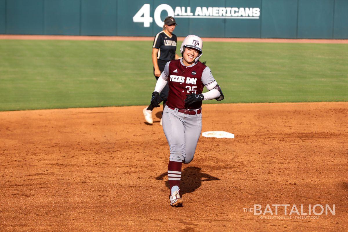 Senior Haley Lee happily rounds the bases after scoring a home run in the first game of the doubleheader. 