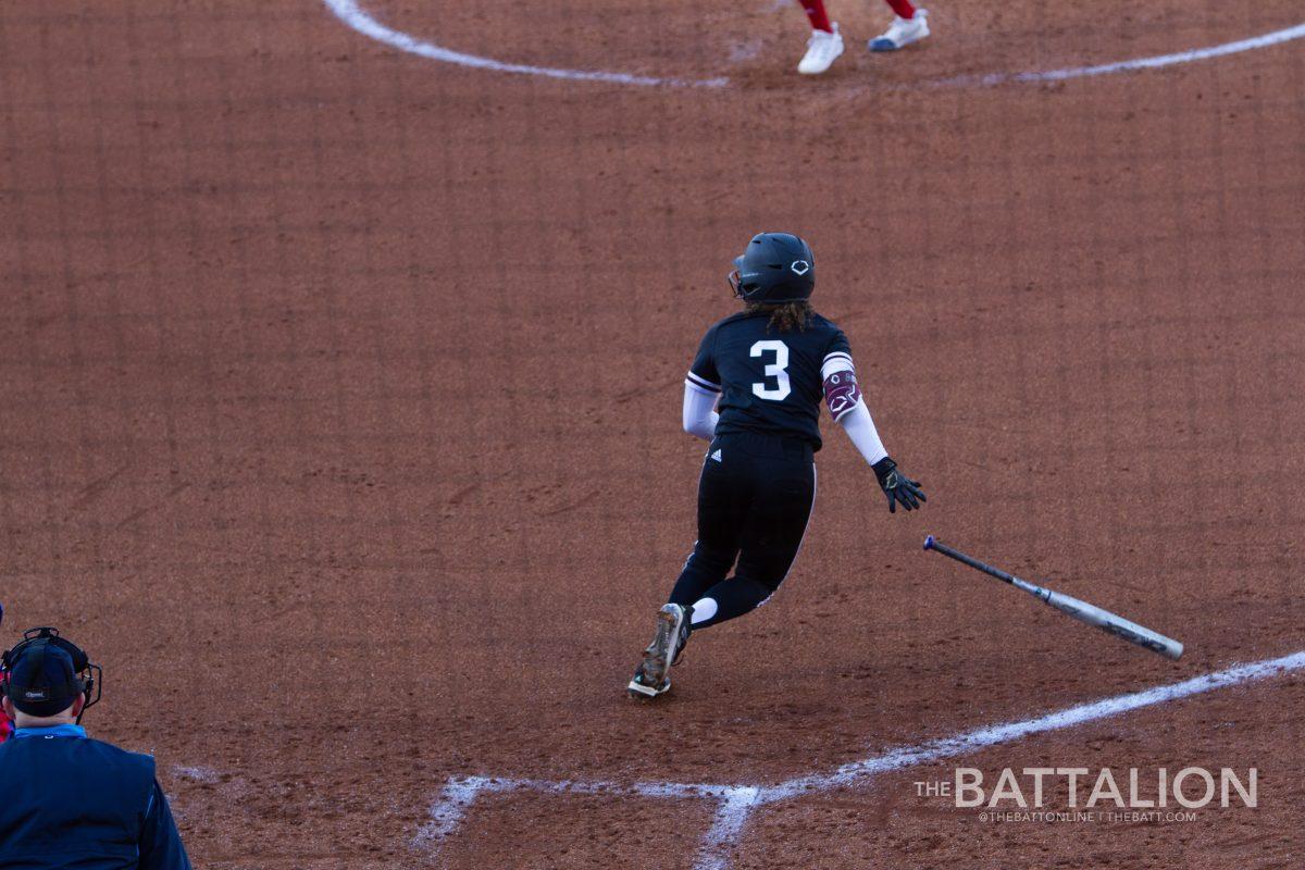 Freshman infielder Koko Wooley (3) running from home plate after a hit against Kansas in Davis Diamond on Friday, Feb. 18, 2022.