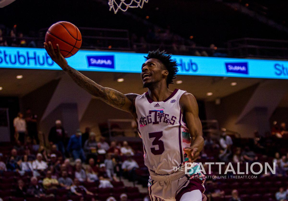 Shooting ahead, graduate Quenton Jackson (3) shoots a basket in Reed Arena on Tuesday, Feb. 22, 2022 against Georgia.
