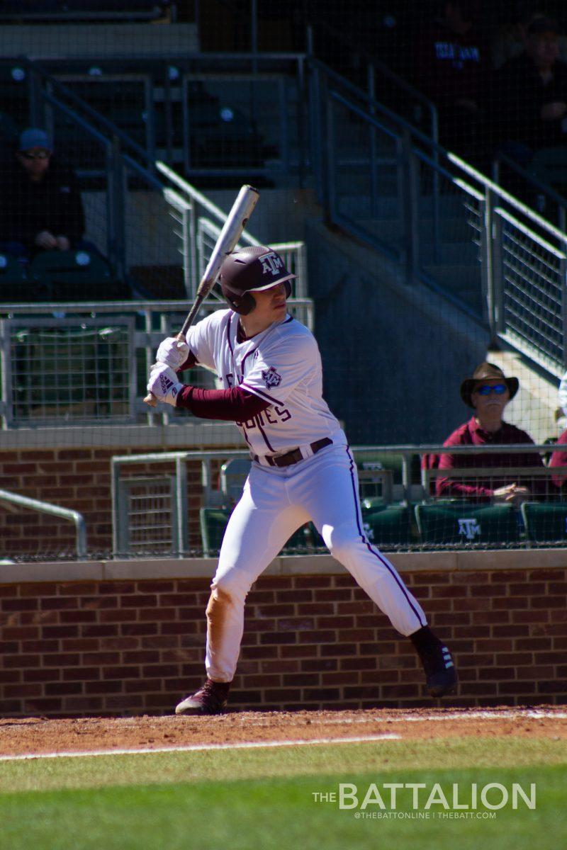 Junior outfielder/infielder Austin Bost (11) bats at home plate at Olsen Field in Blue Bell Park on Saturday, March 12, 2022.