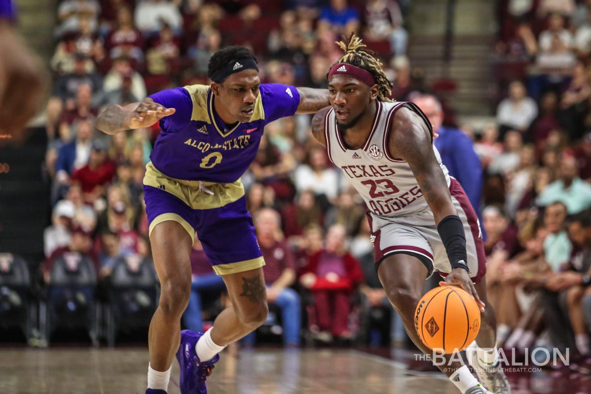 Junior guard Tyrece Radford (23) dribbles down the court in Reed Arena on Tuesday, March 15, 2022.