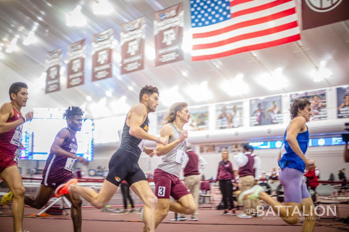 Sophomore Caden Norris rounds the first corner of the track during the 800m race at the SEC Indoor Track and Field Championship on Friday, Feb. 25, 2022.