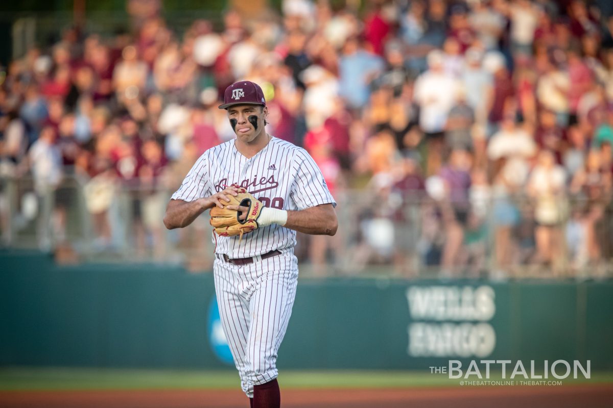 Sophomore third baseman Trevor Werner (28) warms up before the start of the Aggies game against the Razorbacks at Olsen Field on Friday, April 22, 2022.
