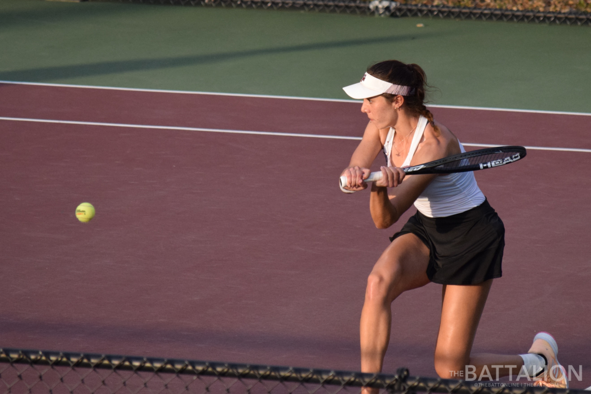 Junior Renee McBryde returns a backhand shot.