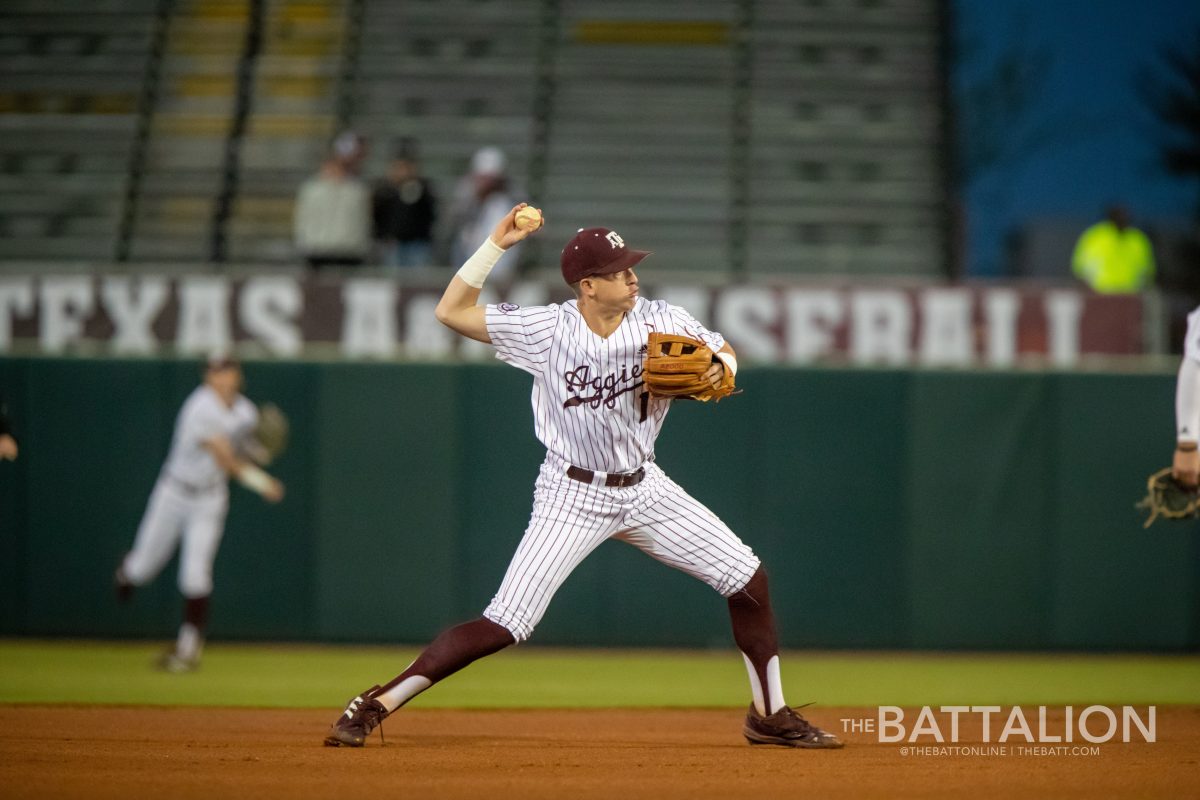 Graduate shortstop Kole Kaler (1) throws to first base before the Aggies game against Kentucky at Blue Bell Park on Thursday, April 7, 2022.