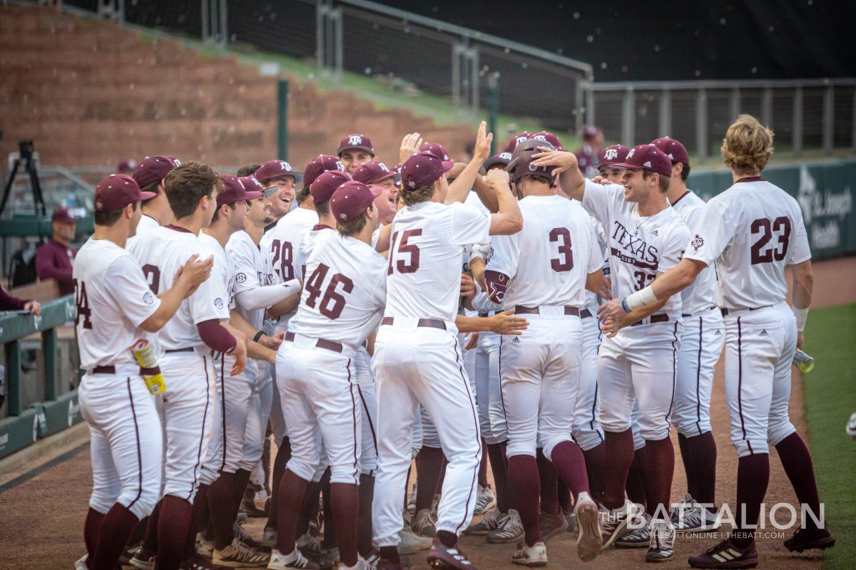 Sophomore designated hitter Logan Britt (3) is congragulated by his teammates after hitting his second home run of the game in Olsen Field on Tuesday, April 19, 2022.