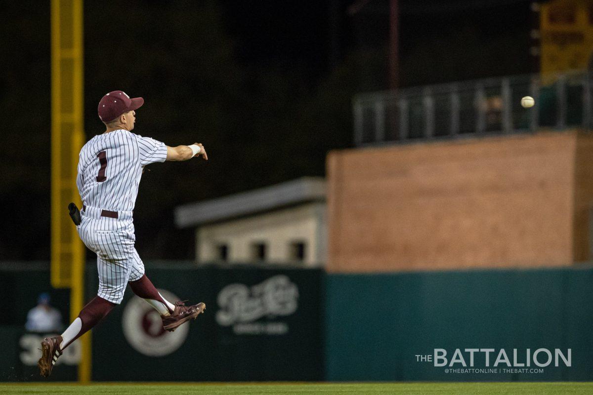 Graduate shortstop Kole Kaler (1) throws to first base during the Aggies game against Kentucky at Blue Bell Park on Thursday, April 7, 2022.