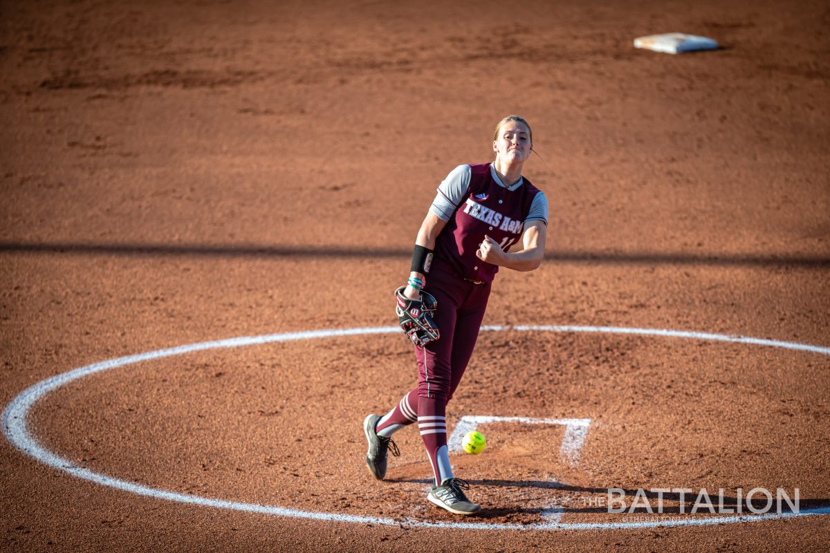 <p>Freshman P/1B Emiley Kennedy (11) throws a pitch during the top of the second inning in the Aggies' game against Lamar in Davis Diamond on Wednesday, April 27, 2022.</p>