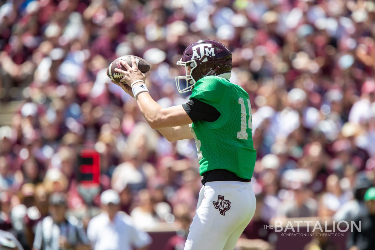 Junior QB Max Johnson (14) catches the ball after the snap in Kyle Field on April 9, 2022.