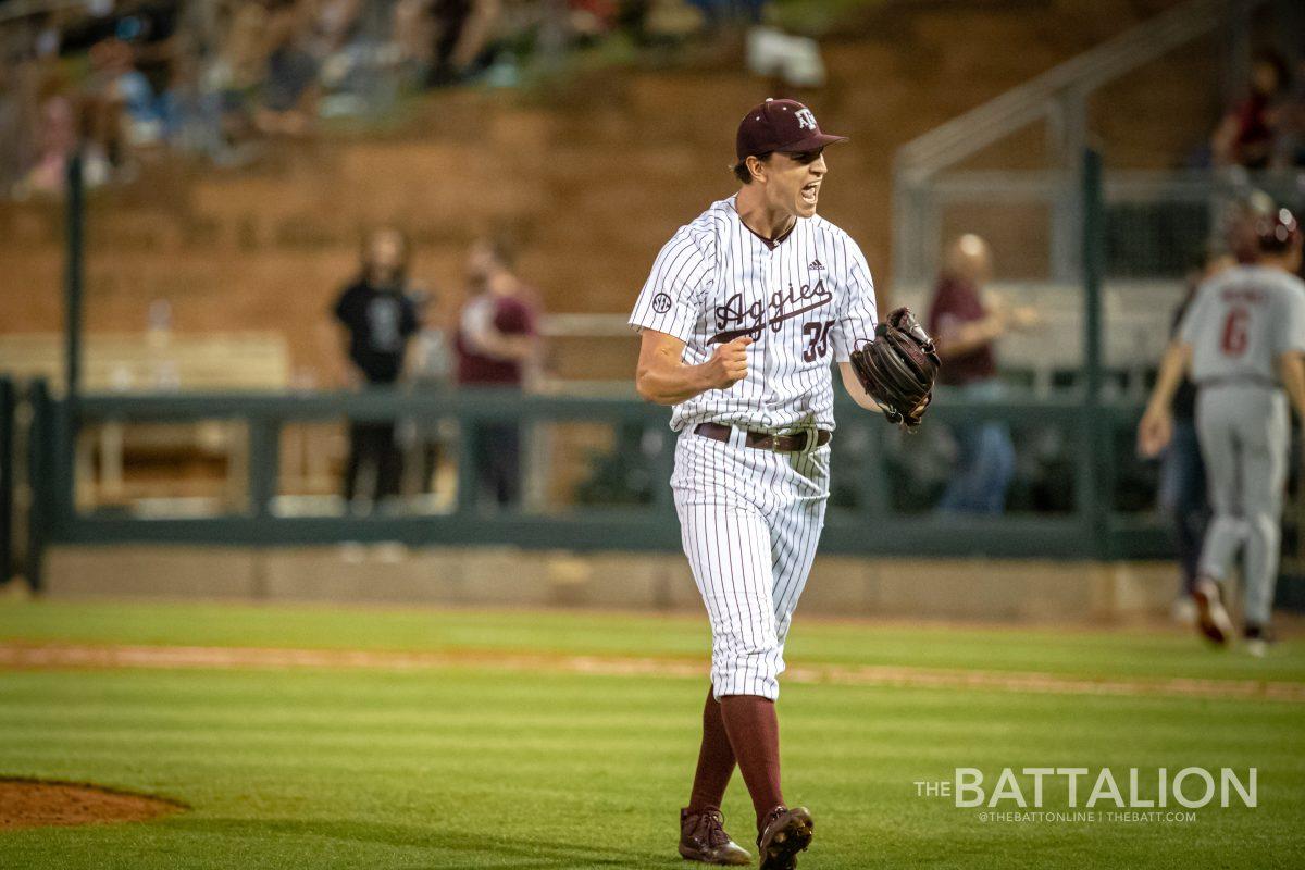 <p>Sophomore pitcher Nathan Dettmer (35) celebrates after earning a strikeout that ends the inning at Olsen Field on Friday, April 22, 2022.</p>